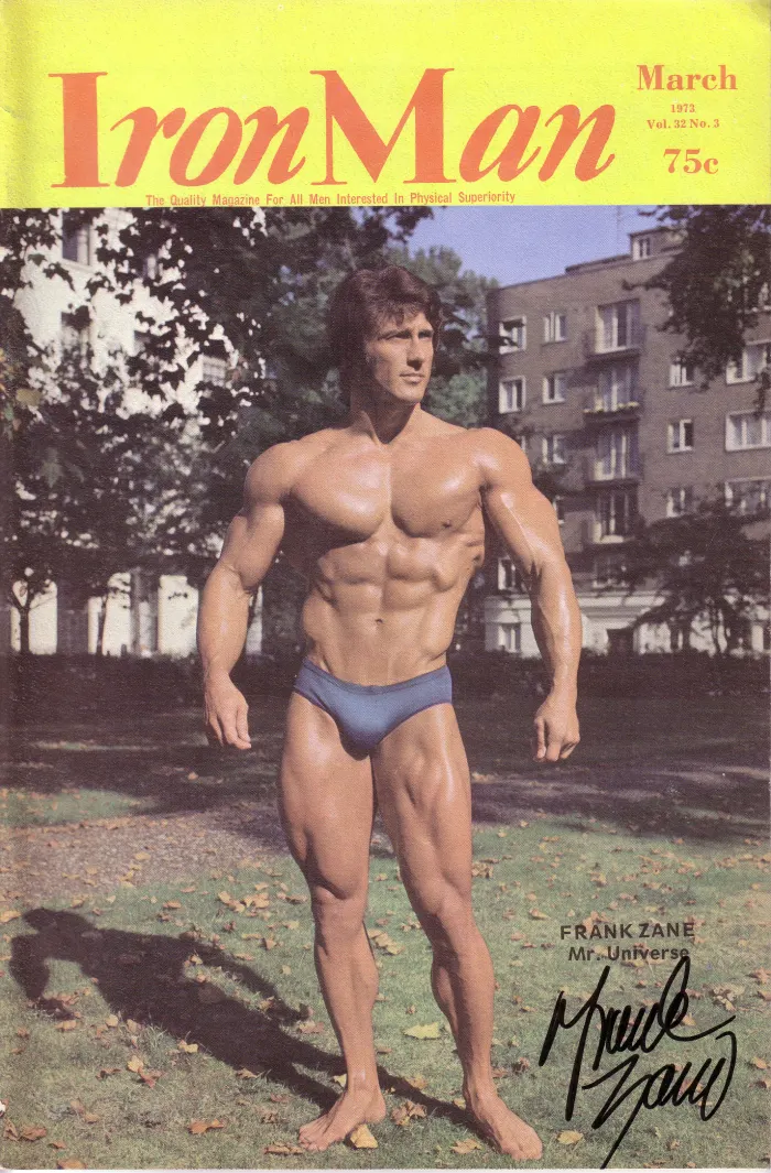 A signed IronMan cover, full-body outdoor European-park shot bearing his own autograph.